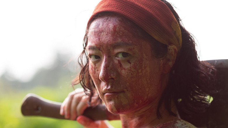 Actress covered in blood holding axe One Cut of the Dead