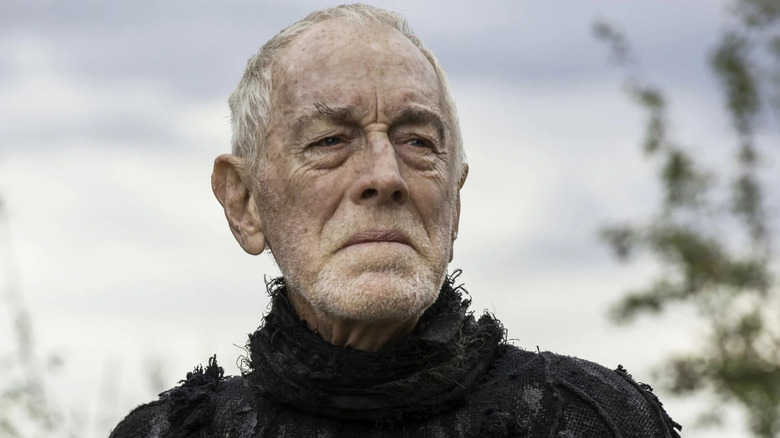 The Three-eyed Raven (Max von Sydow) stands grimly outside in Game of Thrones
