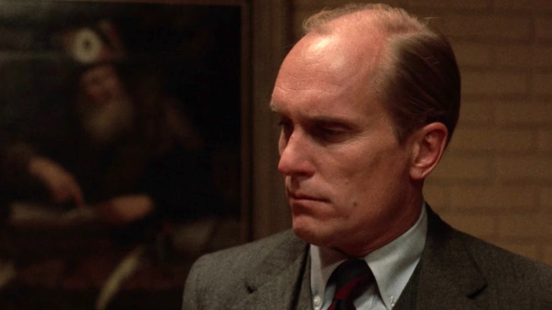 Tom Hagen (Robert Duvall) listens intently in The Godfather Part II