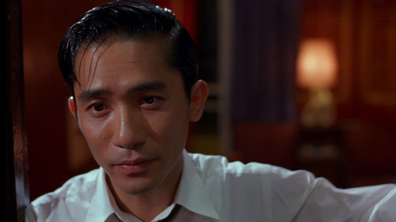 Chow Mo-wan (Tony Leung) opens a door in In the Mood for Love