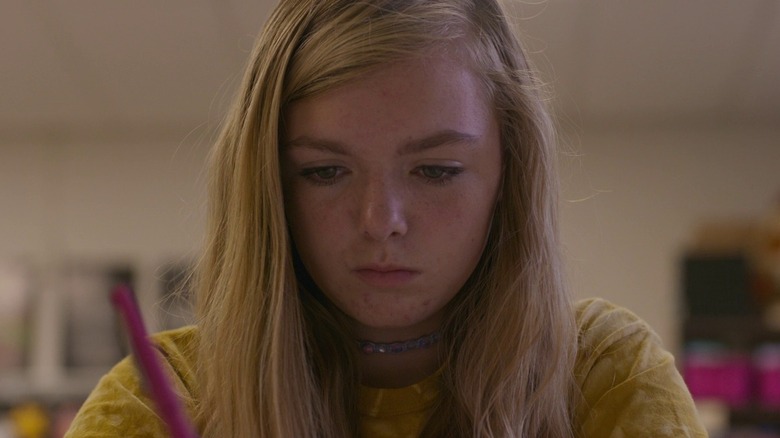 Elsie Fisher as Kayla in Eighth Grade, in class looking down at a paper.