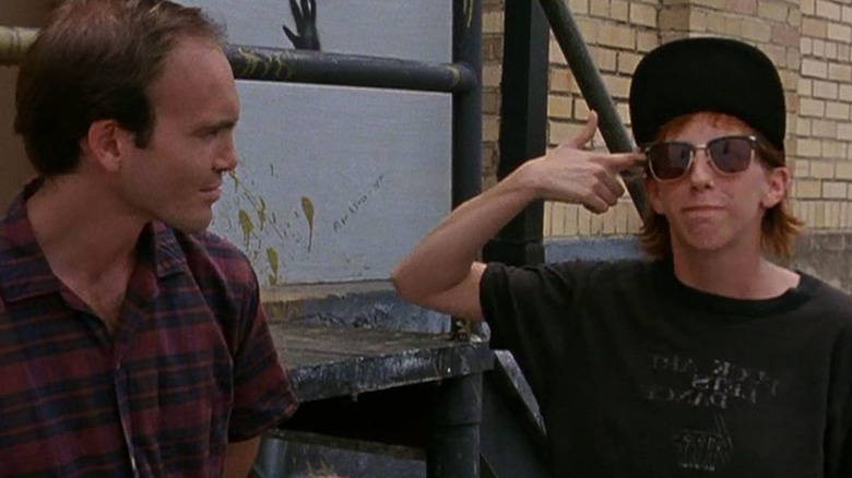 Scott Marcus and Teresa Taylor in Slacker, Taylor holding an imaginary gun to her head.