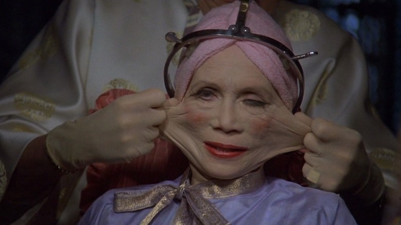 Woman (Katherine Helmond) getting face pulled in Brazil