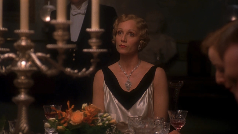 Kristin Scott Thomas as Sylvia McCordle looks concerned at a dinner table in Gosford Park