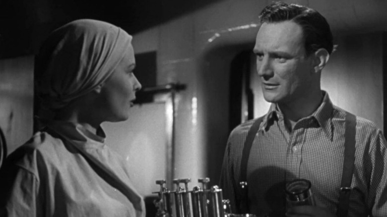 Sally Gray as Nurse Linley talking to Trevor Howard as Dr. Barnes in Green For Danger