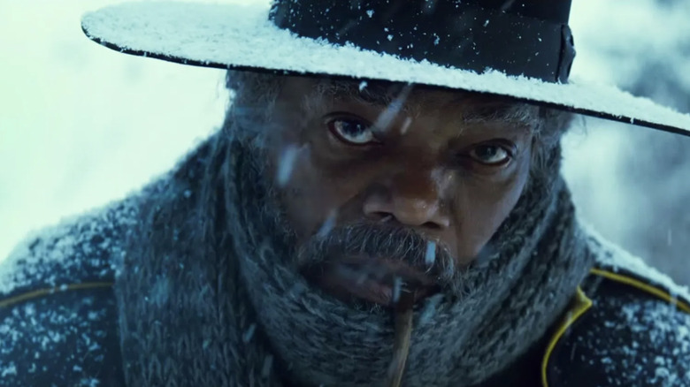 Samuel L. Jackson as Major Marquis Warren standing in the snow in The Hateful Eight