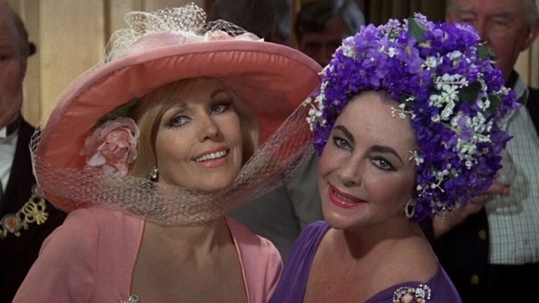 Kim Novak as Lola Brewster and Elizabeth Taylor as Marina Gregg-Rudd posing together in The Mirror Crack'd