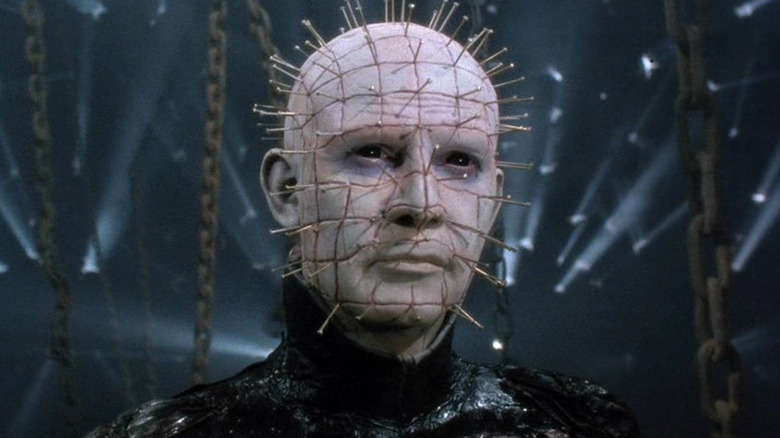 The Hell Priest Pinhead (Doug Bradley) smiles slightly as the light fades behind him in Hellraiser