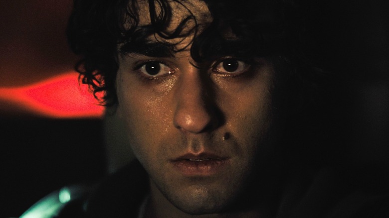 Peter (Alex Wolff) looks shellshocked as events crawl towards a shadowy climax in Hereditary
