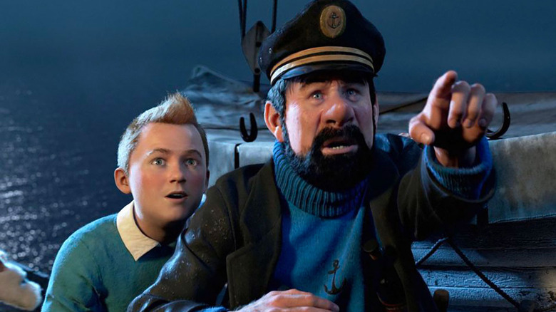 Tintin and Captain Haddock look into the distance on a boat in The Adventures of Tintin