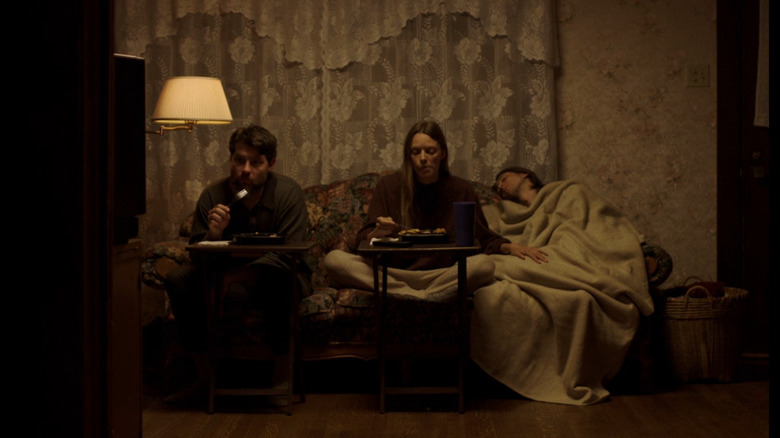 The siblings eat dinner on couch in My Heart Can't Beat Unless You Tell It To