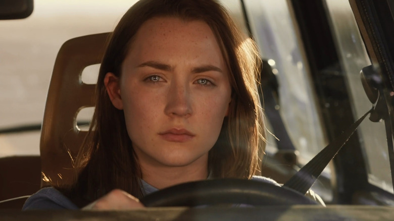 Wanderer (Saoirse Ronan) driving car while experiencing Melanie's memories in The Host