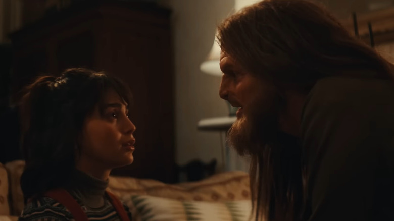 Laura (Melissa Barrera) and Monster (Tommy Dewey) in intense conversation in Your Monster