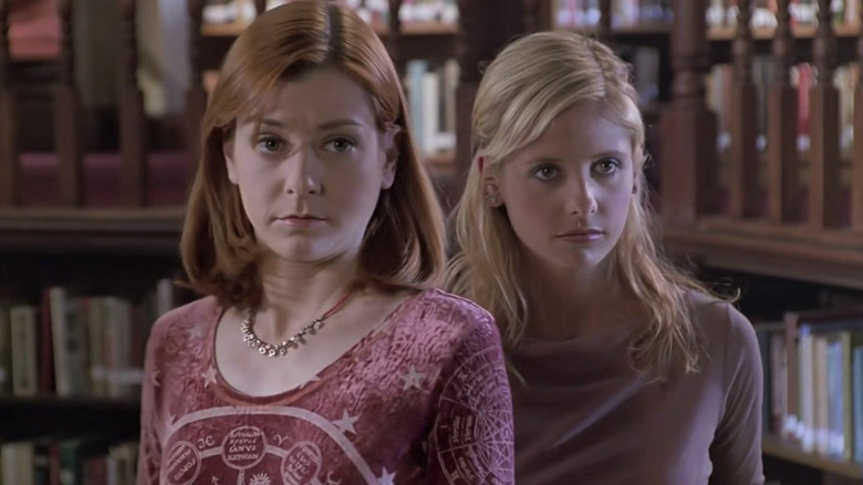 Alyson Hannigan as Willow Rosenberg and Sarah Michelle Gellar as Buffy Summers in the Sunnday High School library in Buffy the Vampire Slayer
