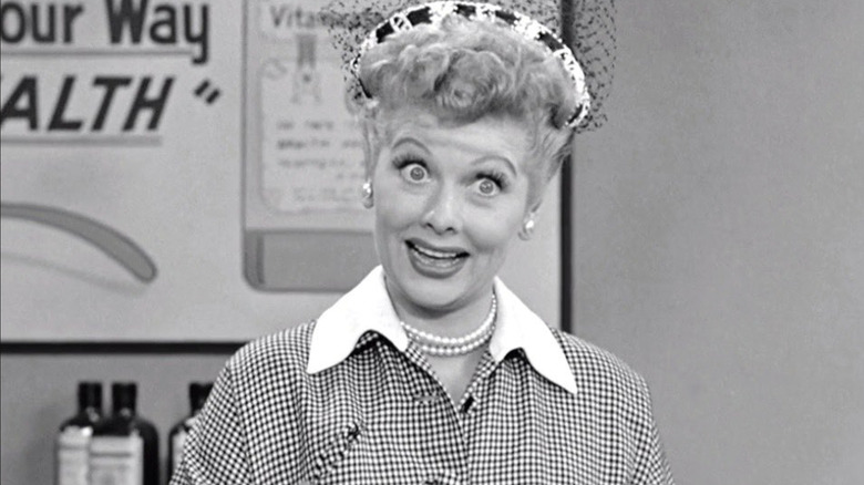 Lucille Ball as Lucy Ricardo holding a spoon during a vegemite commercial in I Love Lucy