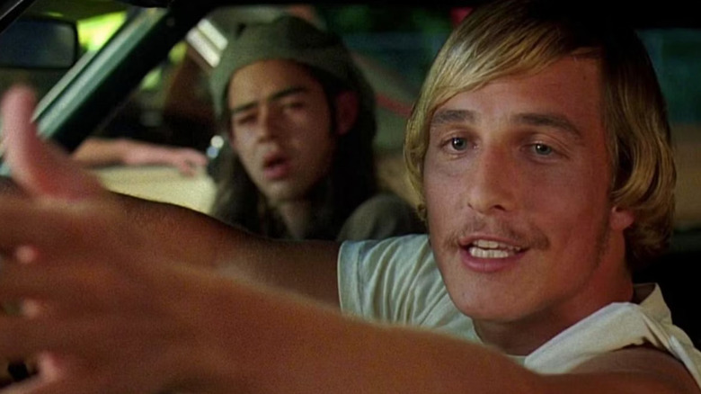 Rory Cochrane as Ron Slater sitting in the passenger seat of a car of the 1970 Chevrolet Chevelle SS 454 driven by Matthew McConaughey as David Wooderson in Dazed and Confused