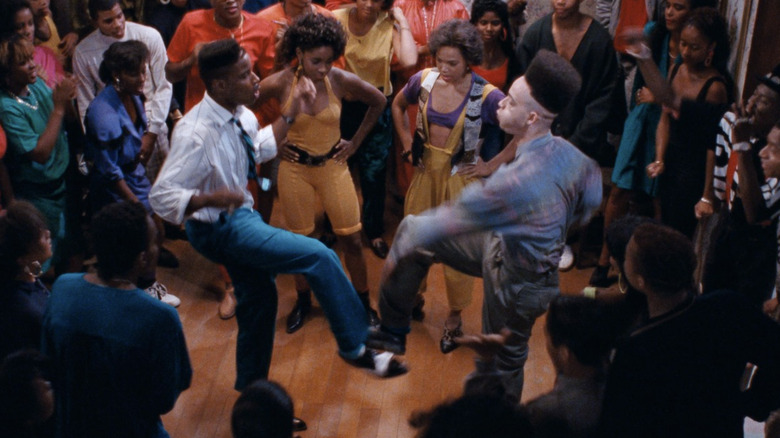 Christopher "Play" Martin as Peter "Play" Martin dancing with Christopher "Kid" Reid as Christopher "Kid" Robinson Jr. in front of A.J. Johnson as Sharane and Tisha Campbell as Sydney in House Party