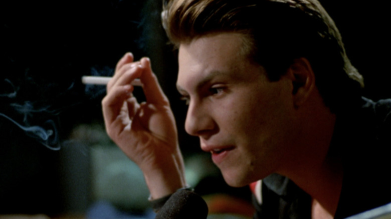 Christian Slater as Mark Hunter AKA Hard Harry smoking and talking into a radio microphone in Pump Up the Volume