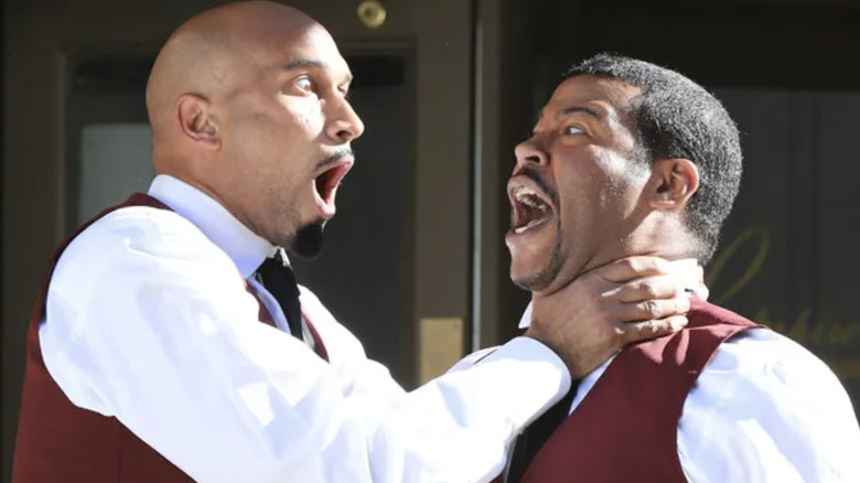 Keegan-Michael Key choking Jordan Peele as the valet guys in a Key & Peele Sketch