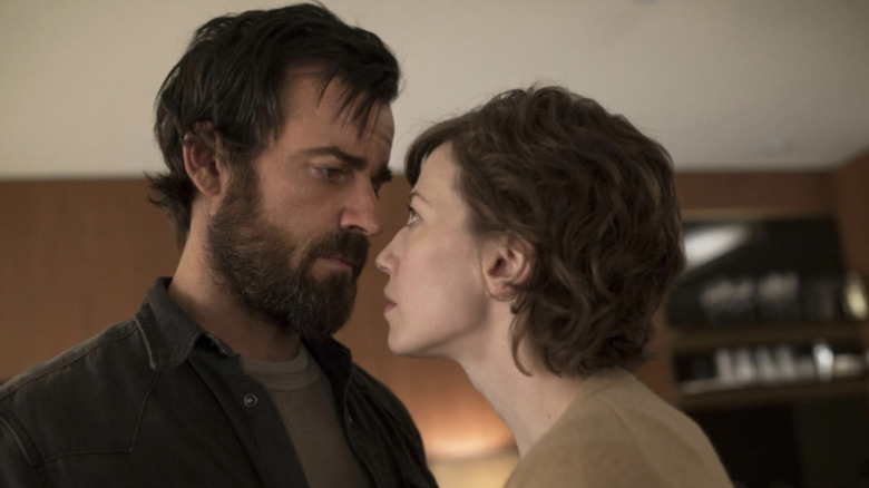 Justin Theroux as Kevin Garvey with a bearding looking down into the eyes of Carrie Coon as Nora Durst in The Leftovers