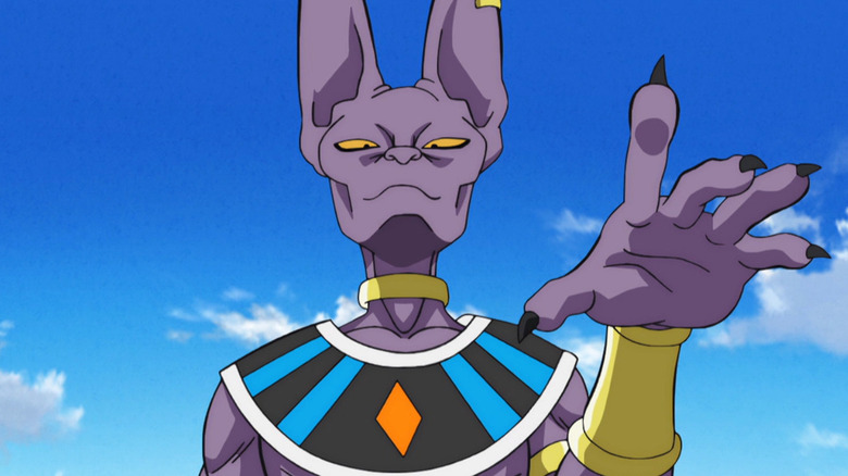 Beerus looks down while raising a hand in Dragon Ball Super