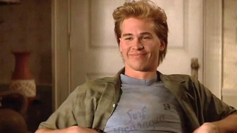 Val Kilmer smirks at his roommate.