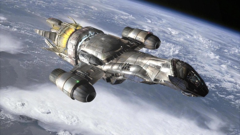 The Serenity ship flying above a planet in Serenity (2005)
