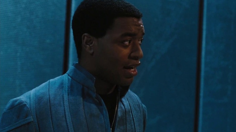 Chiwetel Ejiofor as the Operative from a side profile in Serenity (2005)