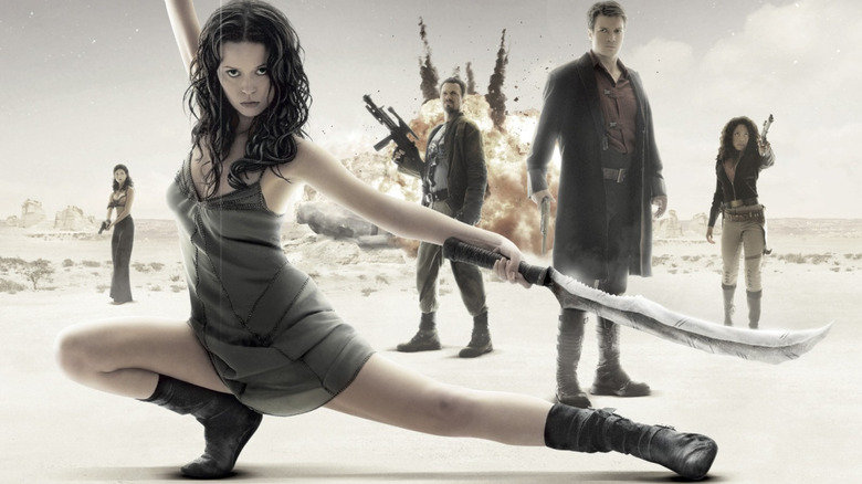 River, Mal, Zoe, Jayne, and Iinara in front of an explosion on the poster for Serenity (2005)