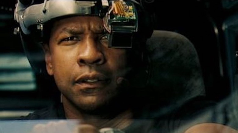 Denzel Washington as Doug Carlin dons a time window helmet while chasing down a truck in the past in Déjà Vu