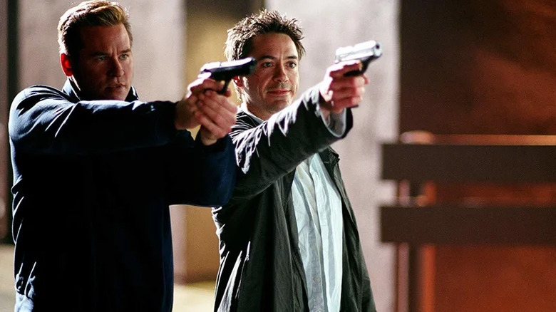 Harry and Perri pointing their guns at someone in Kiss Kiss Bang Bang