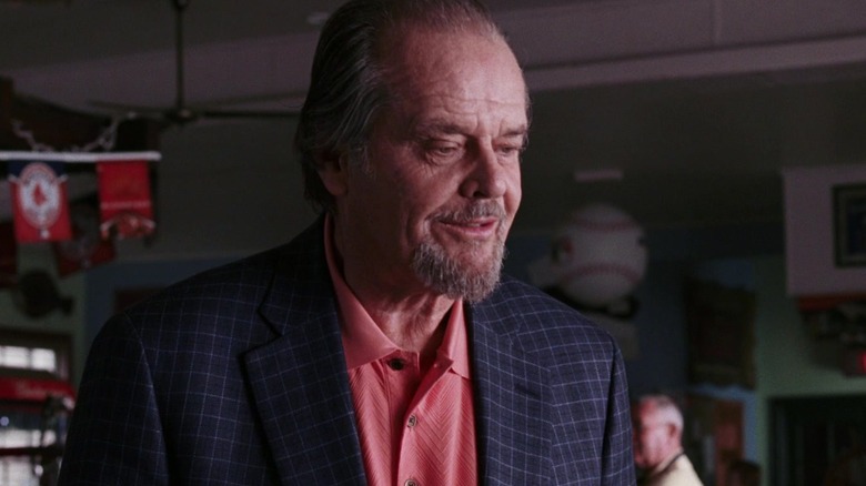 Frank Costello wearing a salmon-colored shirt under a dark jacket in The Departed