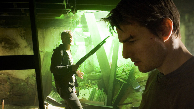 Tom Cruise as Ray in the basement with Tim Robbins as Harlan in War of the Worlds (2005)