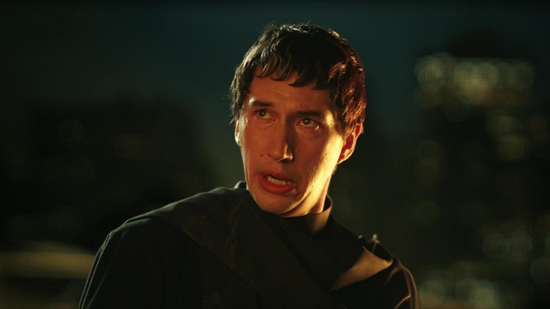 Adam Driver as Cesar Catalina looking upwards in Megalopolis