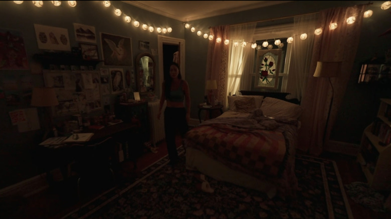 Callina Liang as Chloe Payne stands in her bedroom in Presence