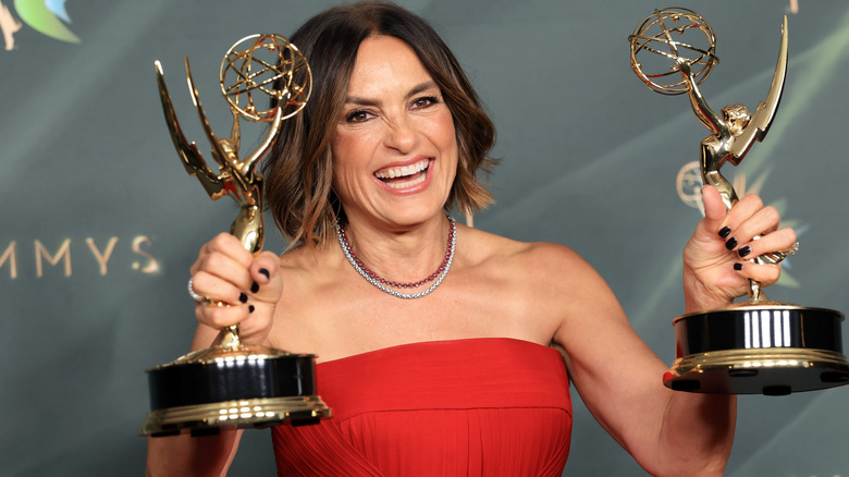 Mariska Hargitay holding two Emmy Awards