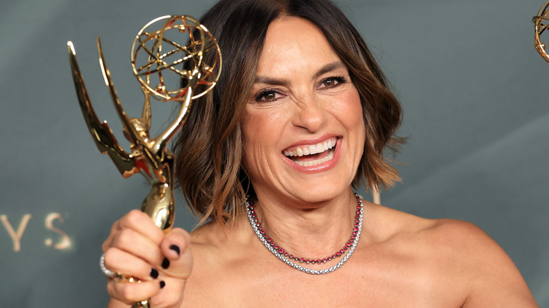 Mariska Hargitay holding two Emmy Awards