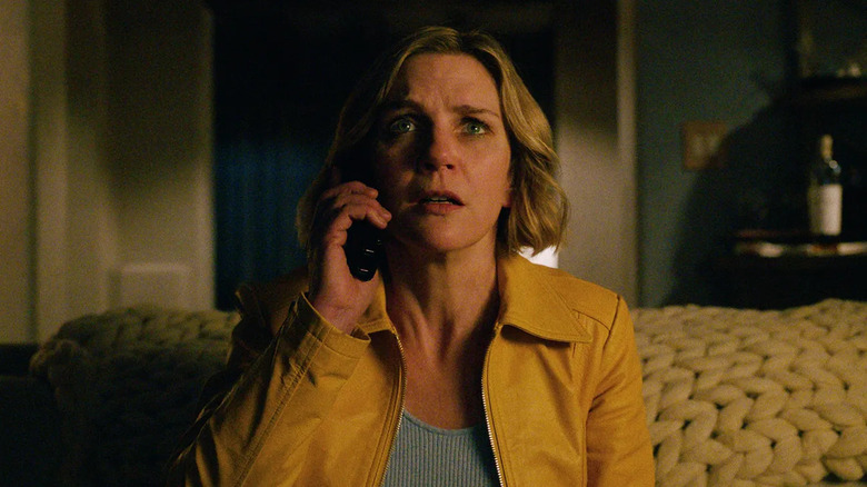 Carol on the phone looking alarmed in Pluribus