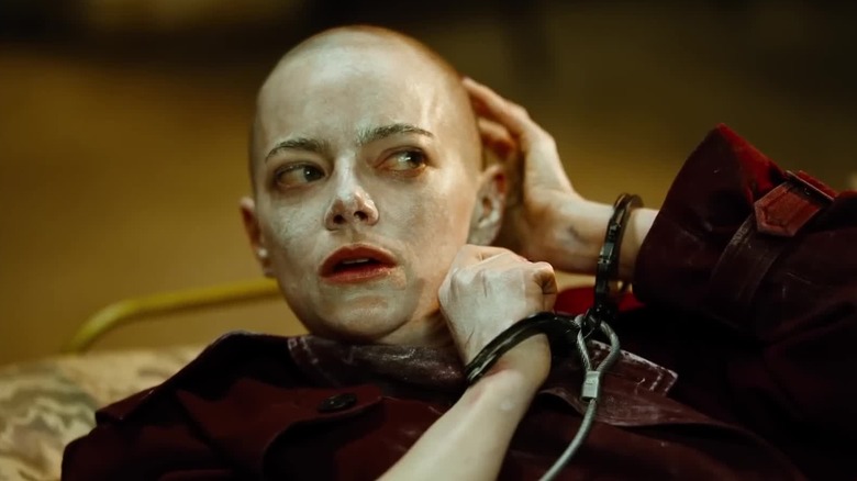 Emma Stone as Michelle Fuller, bound and shaven in Bugonia