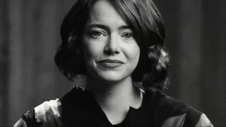 Emma Stone sitting down and smiling in a Squarespace commercial