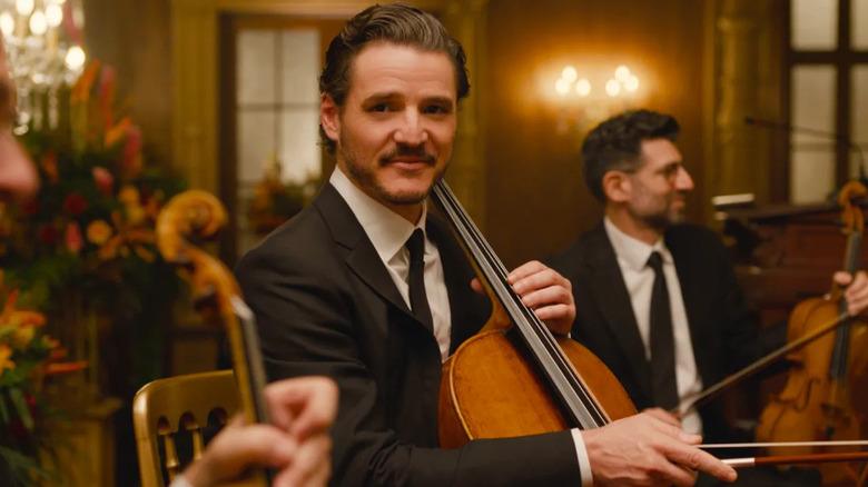 Alex smiling and holding his cello in Behemoth!