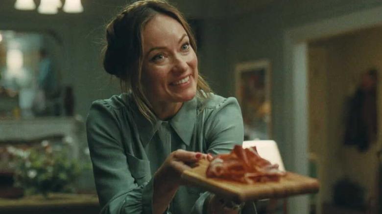 Angela aggressively offering jamon in The Invite