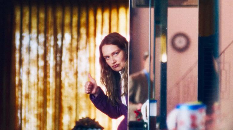 Andie coming around a corner and giving Chris the thumbs up in Primetime