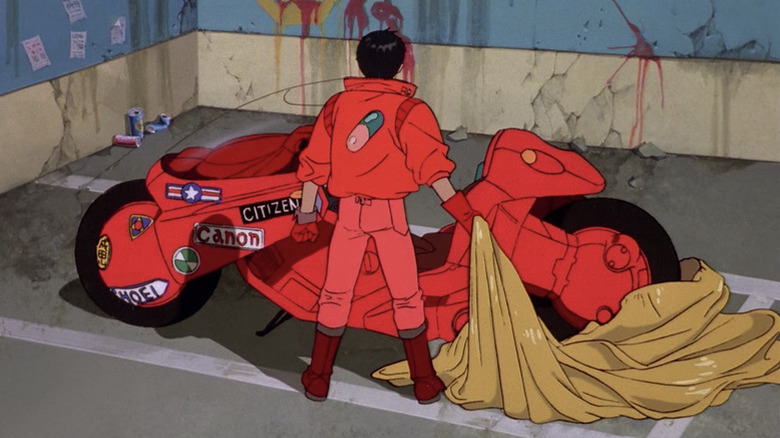 Shōtarō Kaneda (Mitsuo Iwata) uncovers his motorcycle in Akira (1988)