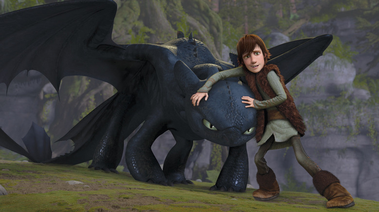 Hiccup (Jay Baruchel) tries to hold back Toothless (Randy Thorn) in How to Train Your Dragon