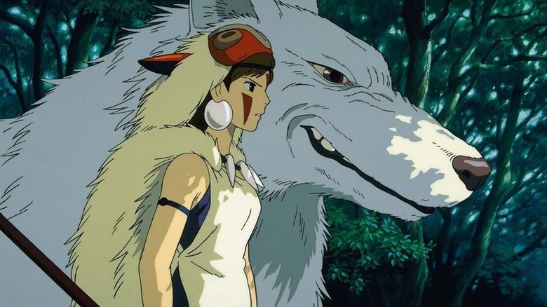 San (Yuriko Ishida) stands next to Moro (Akihiro Miwa) in Princess Mononoke