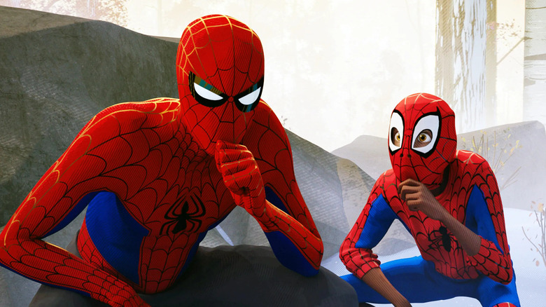 Miles Morales (Shameik Moore) mimics Peter Parker (Jake Johnson) as he puts his hand on his chin in Spider-Man: Into the Spider-Verse