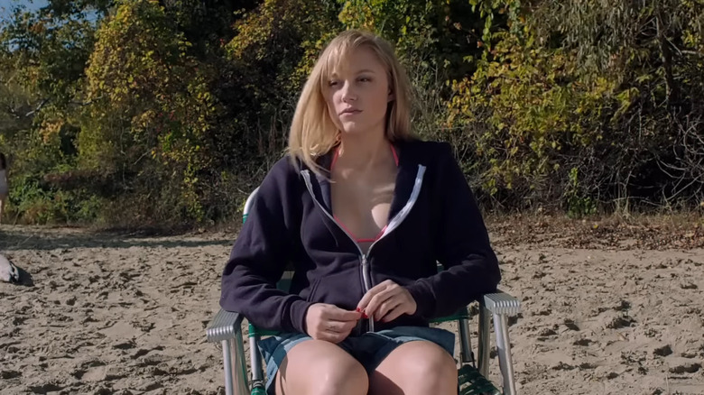 Maika Monroe's Jay Height sitting on a chair in It Follows