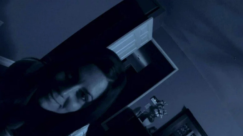 Katie Featherston's Kate smiling at the camera in Paranormal Activity