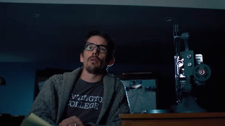 Ethan Hawke's Ellison Oswalt watching a video in Sinister
